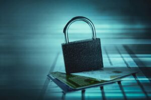 Online shopping cart on a laptop screen with warning sign